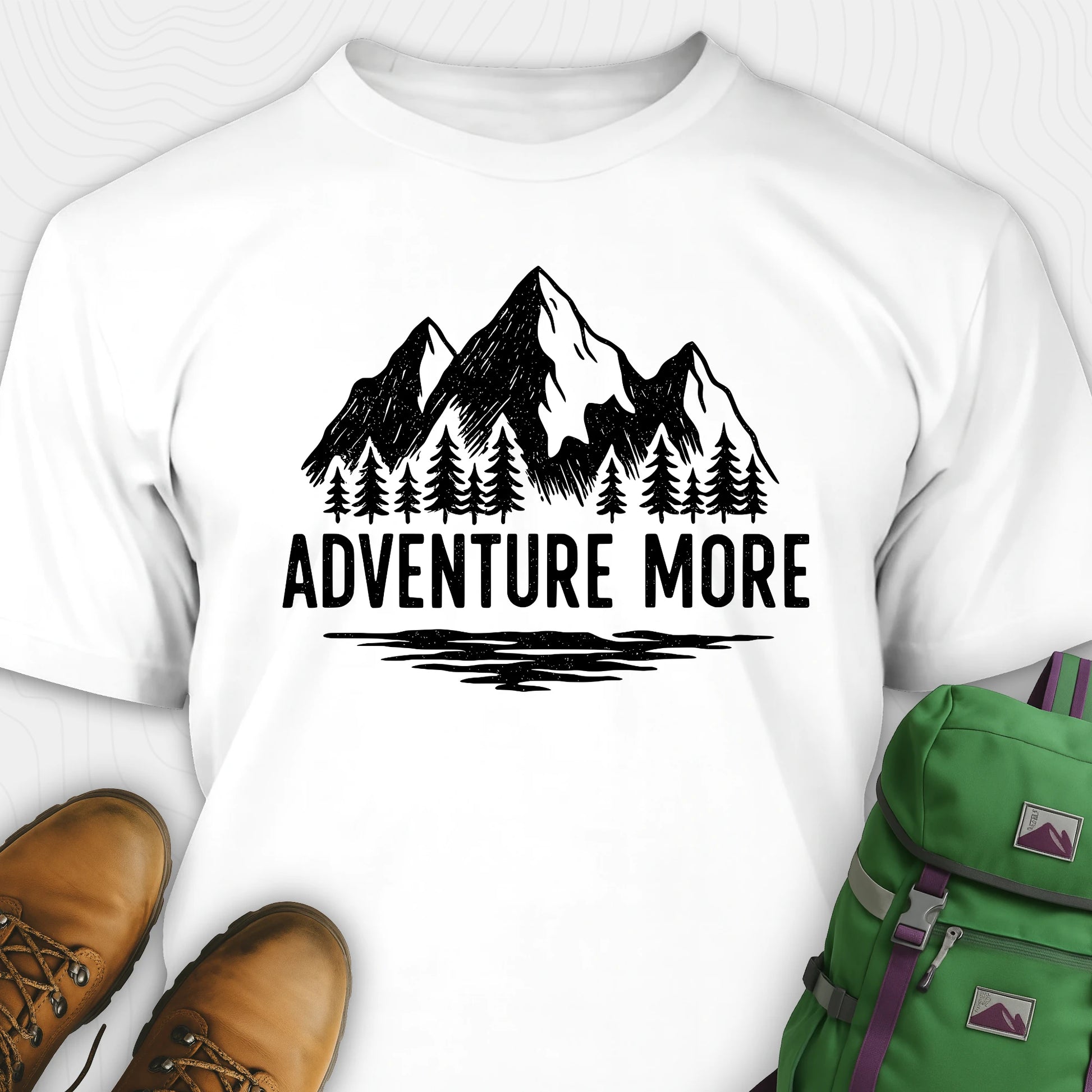 White adventure t-shirt with black mountain and tree graphic on a soft cotton tee
