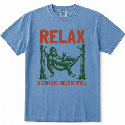 Blue Jean crewneck t-shirt featuring a vintage-style graphic of Bigfoot lounging in a hammock with the text 'RELAX' above and 'NOTHING IS UNDER CONTROL' below in red.