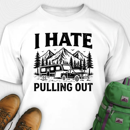 White t-shirt with 'I HATE PULLING OUT' graphic design featuring a truck and camper, paired with brown boots and a green backpack on a white background.
