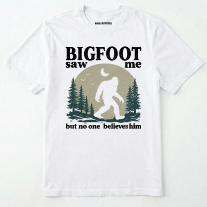 White bigfoot saw me shirt with a vintage outdoor sasquatch in the forest graphic on a white background.