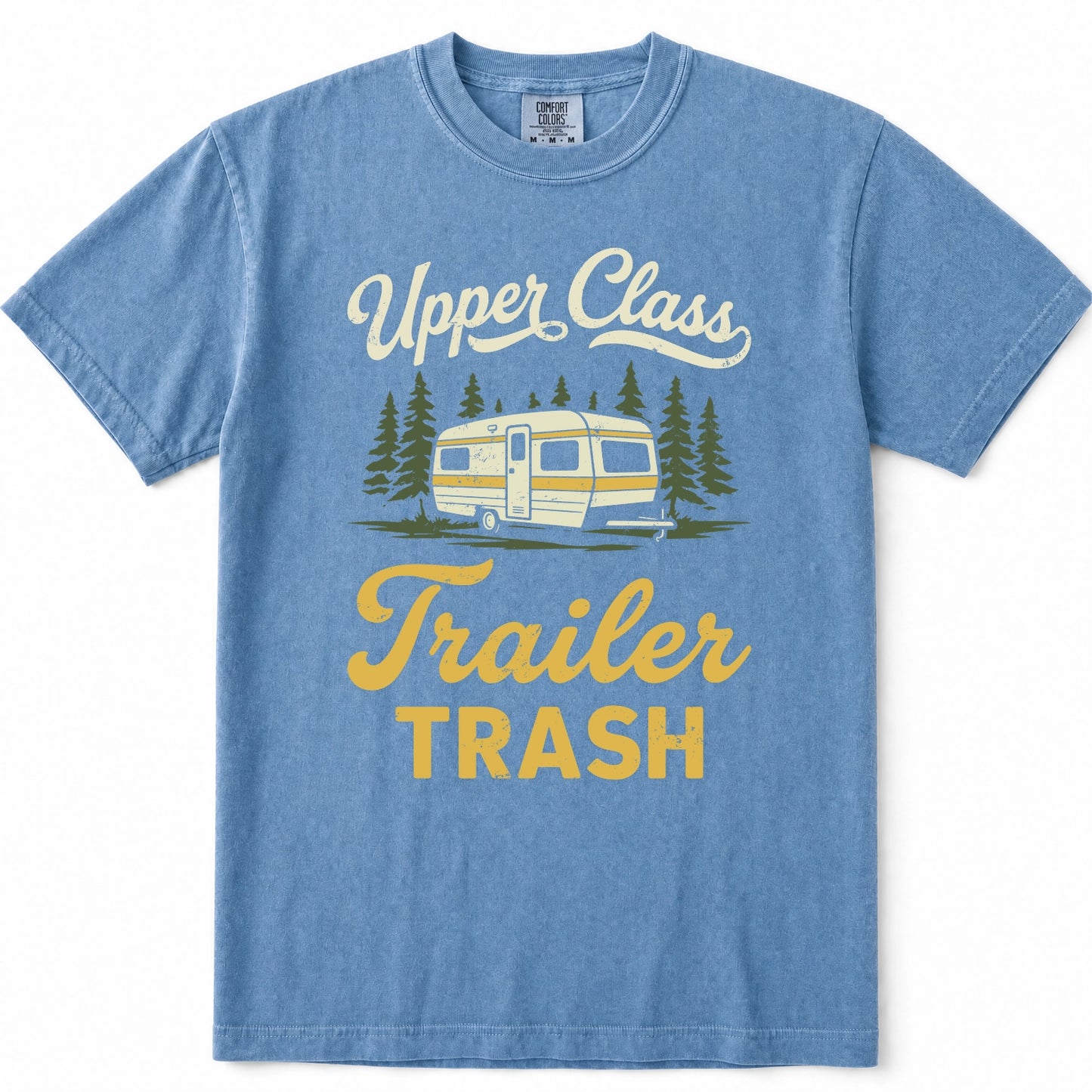 Blue Jean heathered t-shirt with a vintage-style graphic on the front featuring the text 'Upper Class Trailer TRASH' in white and yellow, along with an illustration of a camper trailer and pine trees.