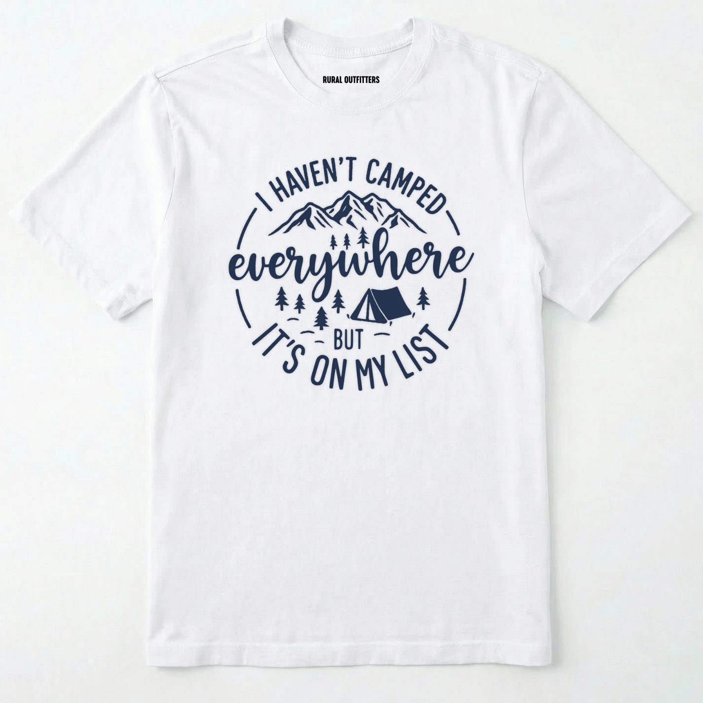 White funny camping shirt saying with mountains, trees, tent graphic and "I Haven't Camped Everywhere But It's On My List" text on a white background.