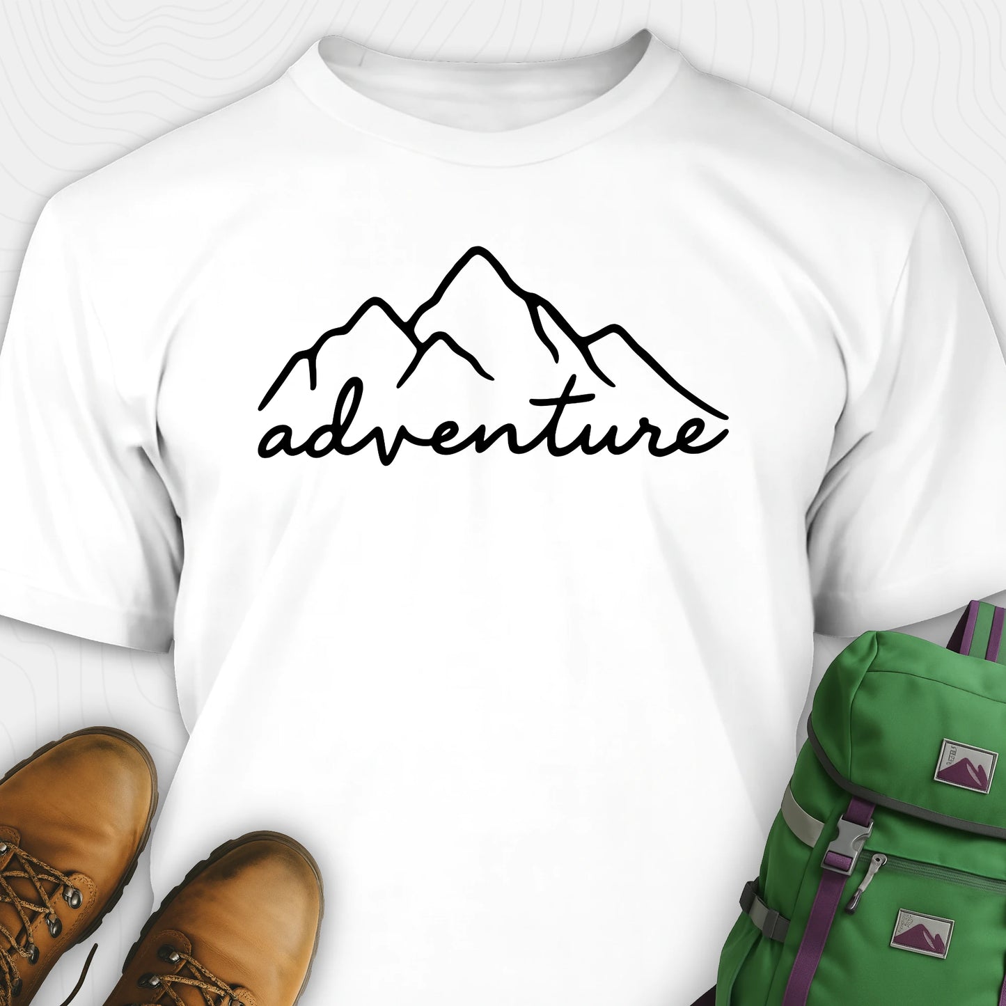 White adventure shirt with mountain design and 'adventure' text, paired with brown boots and a green backpack.