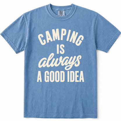 Blue Jean crewneck t-shirt with a distressed graphic on the front that reads 'CAMPING IS always A GOOD IDEA' in cream-colored lettering, displayed flat against a white background.