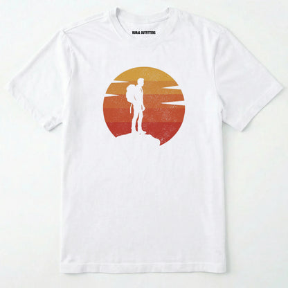 White retro sunset t-shirt with hiker silhouette on a white background.