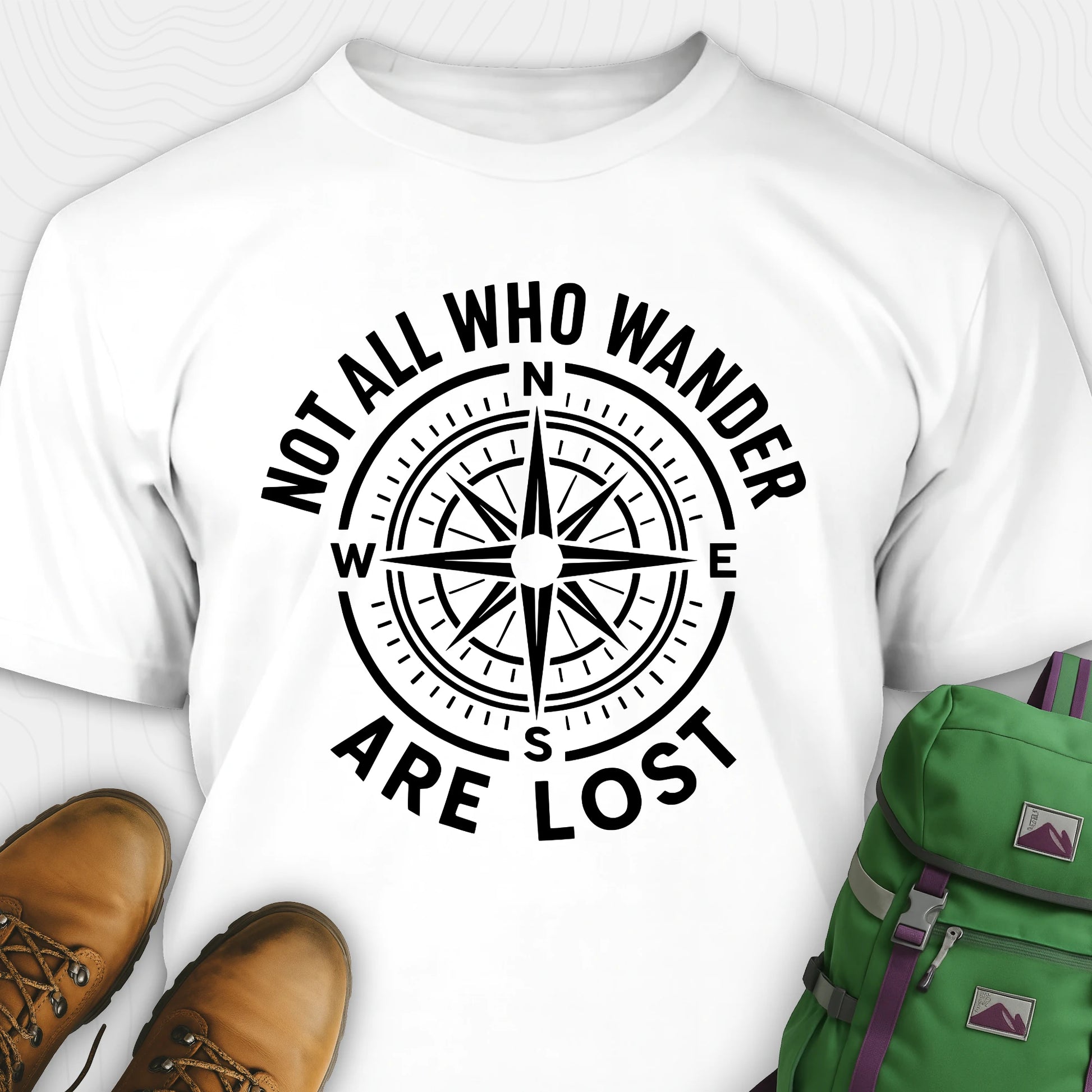 White Not All Who Wander Are Lost T-shirt with compass design and text 'Not all who wander are lost' on a white background.