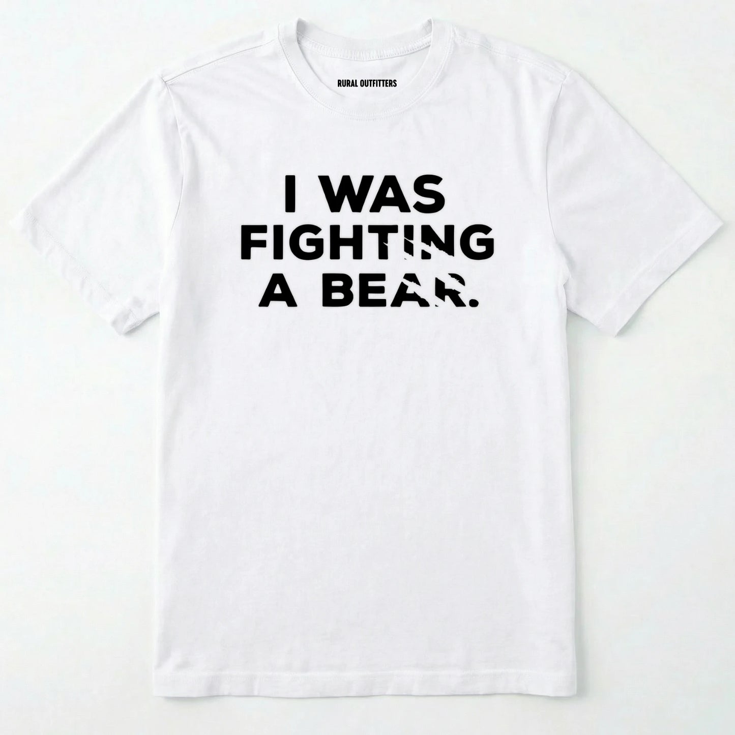 White i was fighting a bear shirt with a bear scratch mark graphic on a white background.