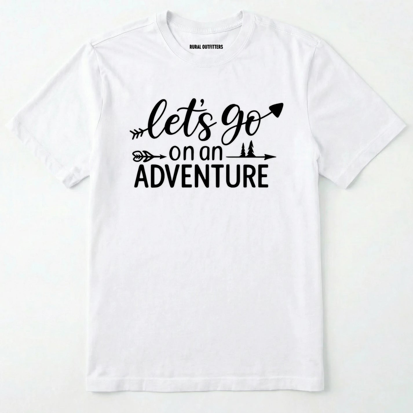 White lets go on an adventure shirt with an arrow and trees graphic on a light grey background.