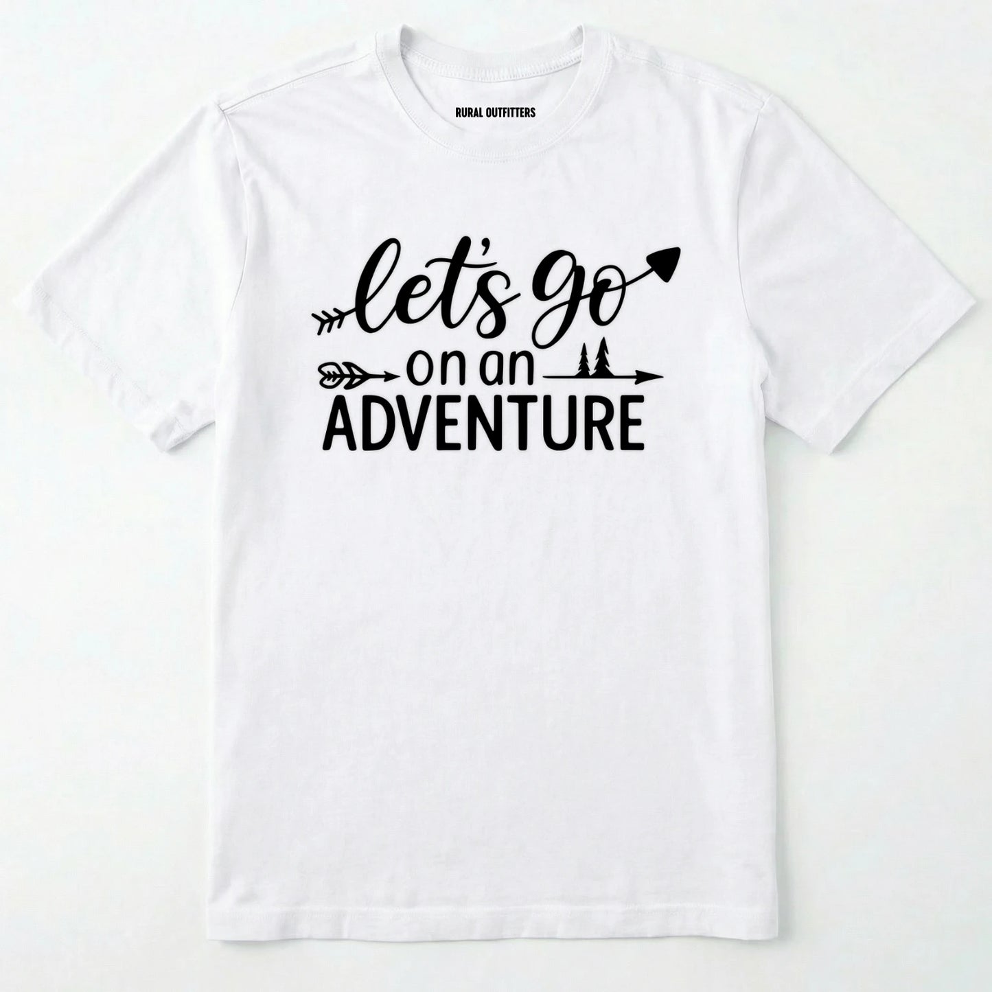 White lets go on an adventure shirt with an arrow and trees graphic on a light grey background.