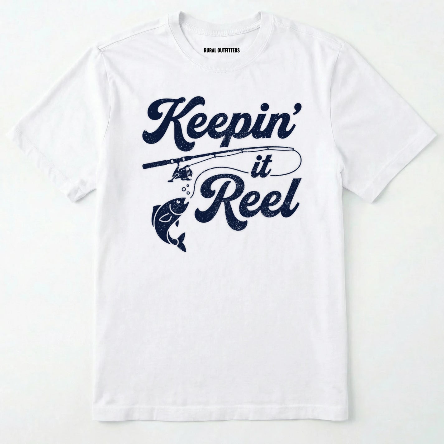 White t-shirt with 'keepin' it reel' text and fishing rod graphic on a white background