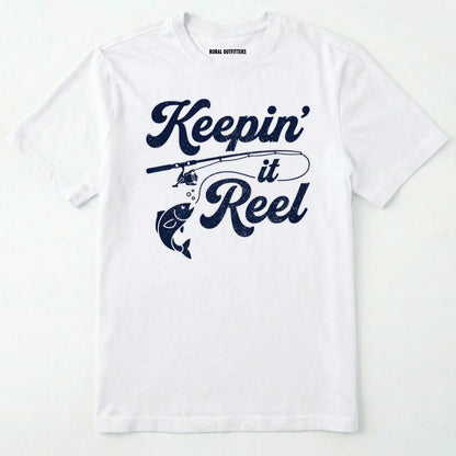 White t-shirt with 'keepin' it reel' text and fishing rod graphic on a white background
