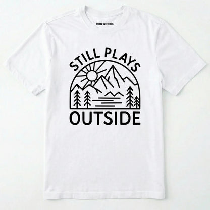 White t-shirt with 'still plays outside' graphic design on a white background