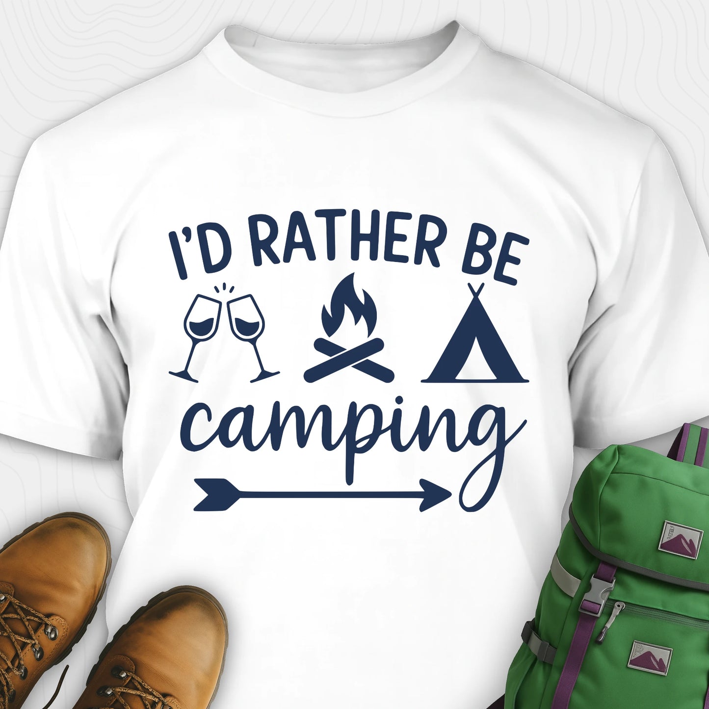 White women's camping shirt with 'I'd Rather Be Camping' design, green backpack, and brown boots on a white background