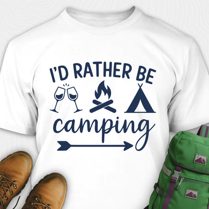 White women's camping shirt with 'I'd Rather Be Camping' design, green backpack, and brown boots on a white background