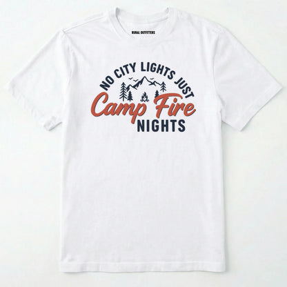 White campfire shirt with mountains and trees design and "no city lights just campfire nights" text on a white background.