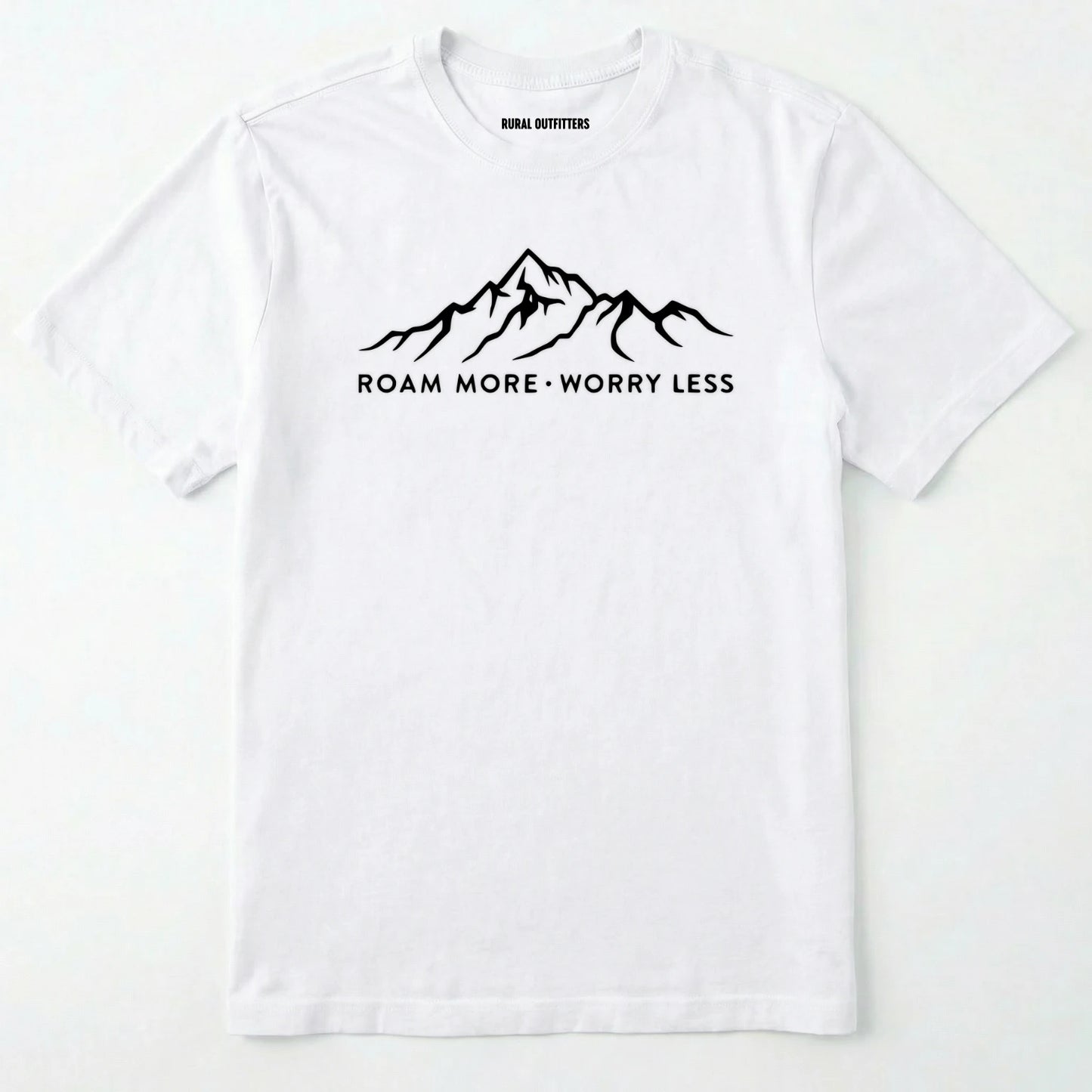 White rocky mountain shirt with a white mountain graphic and text 'roam more worry less' on a white background