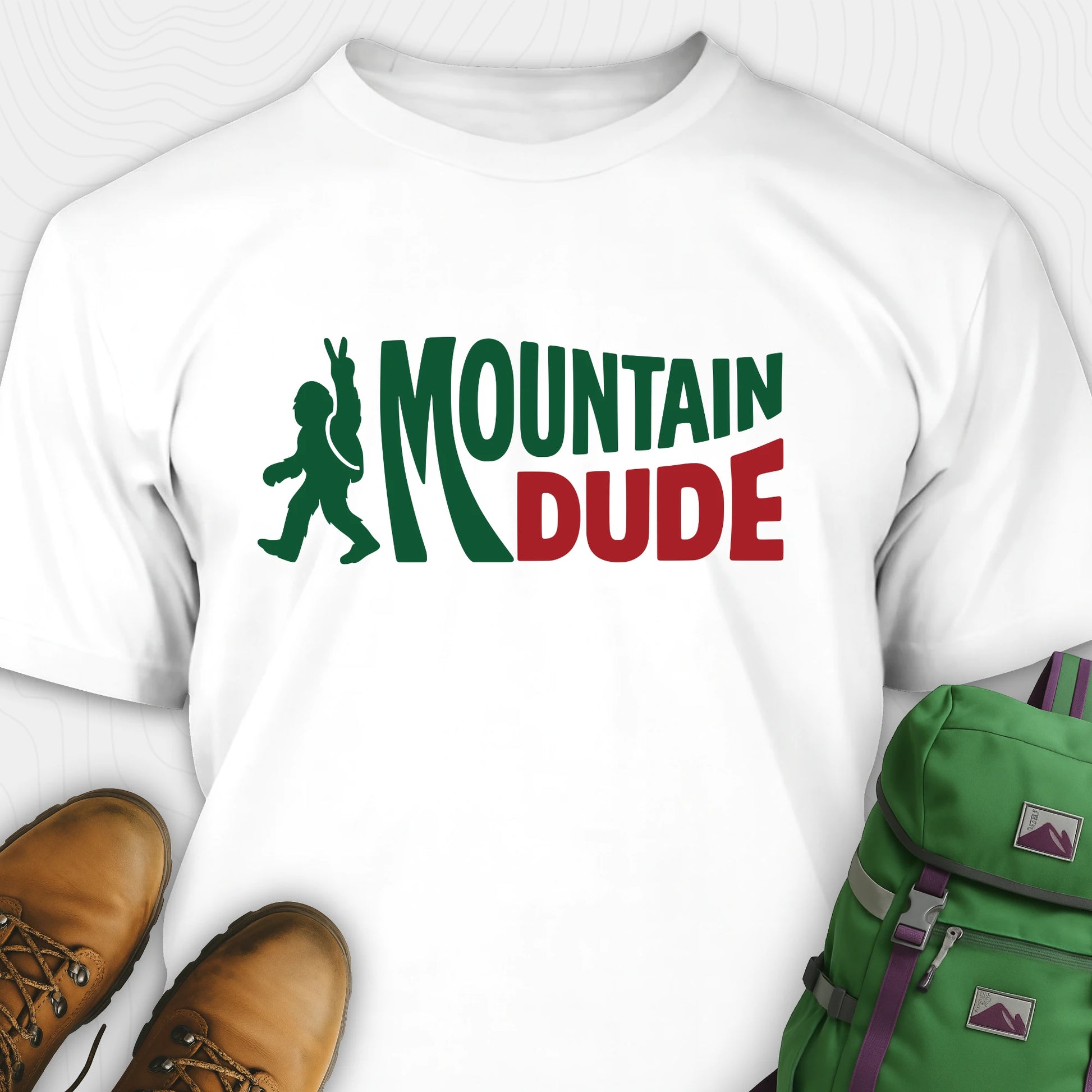 White Mountain Dude shirt with green and red text and Bigfoot graphic.