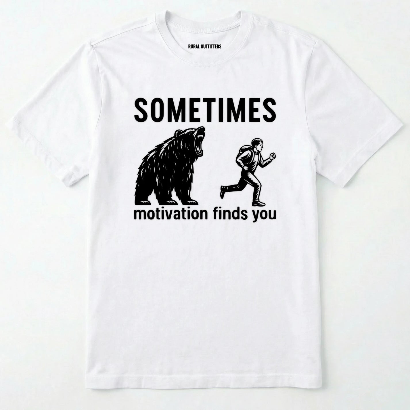 White motivational t-shirt with bear and person graphic and text 'sometimes motivation finds you' on a white background.