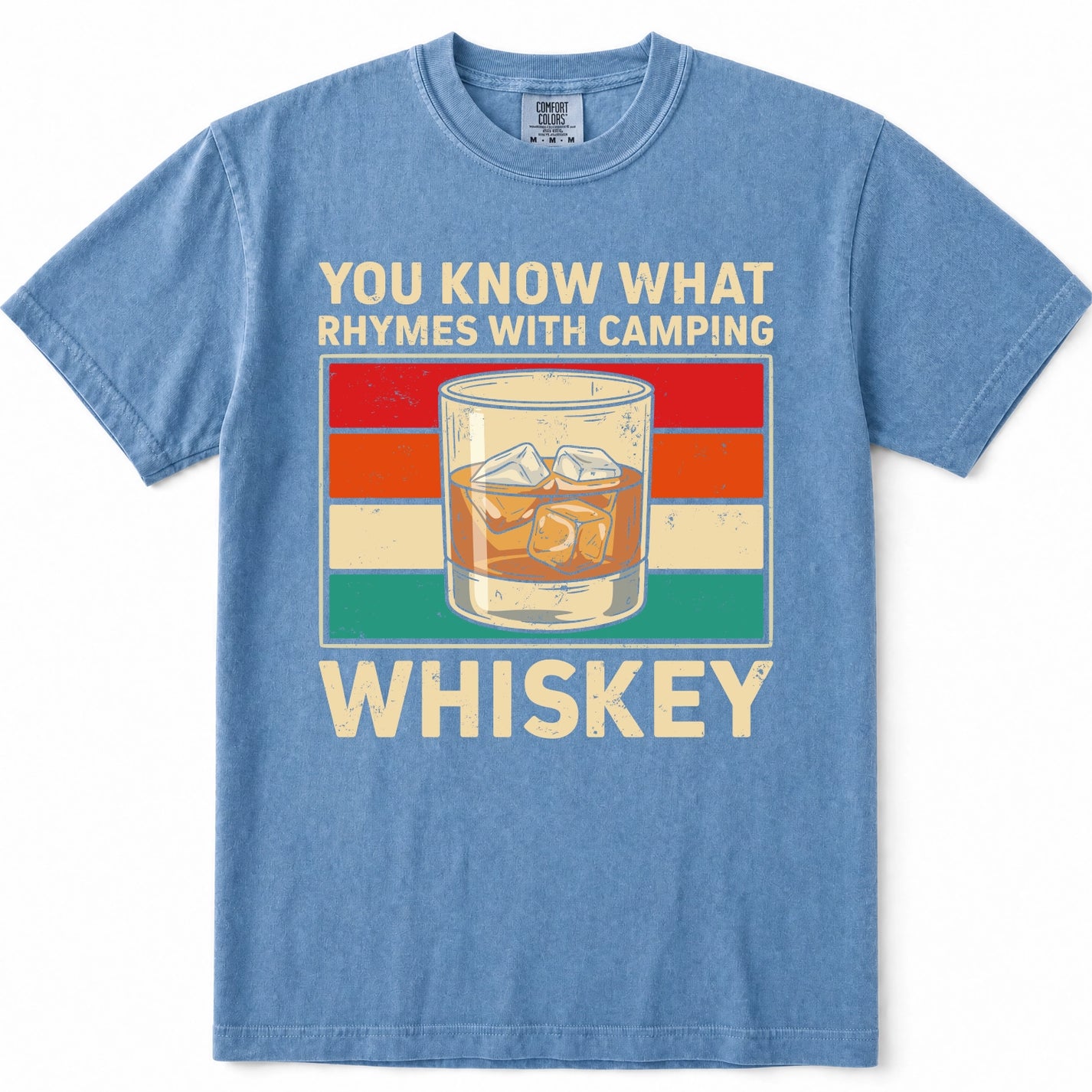 Blue Jean crewneck t-shirt with a vintage-style graphic on the front. The graphic features the text 'YOU KNOW WHAT RHYMES WITH CAMPING' above a retro striped background and an illustration of a whiskey glass, with 'WHISKEY' printed below in large cream letters.