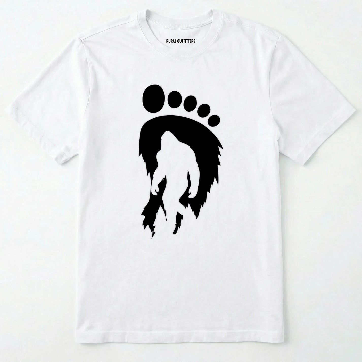 White bigfoot t-shirt with cryptid-themed footprint graphic and sasquatch silhouette on a white background.