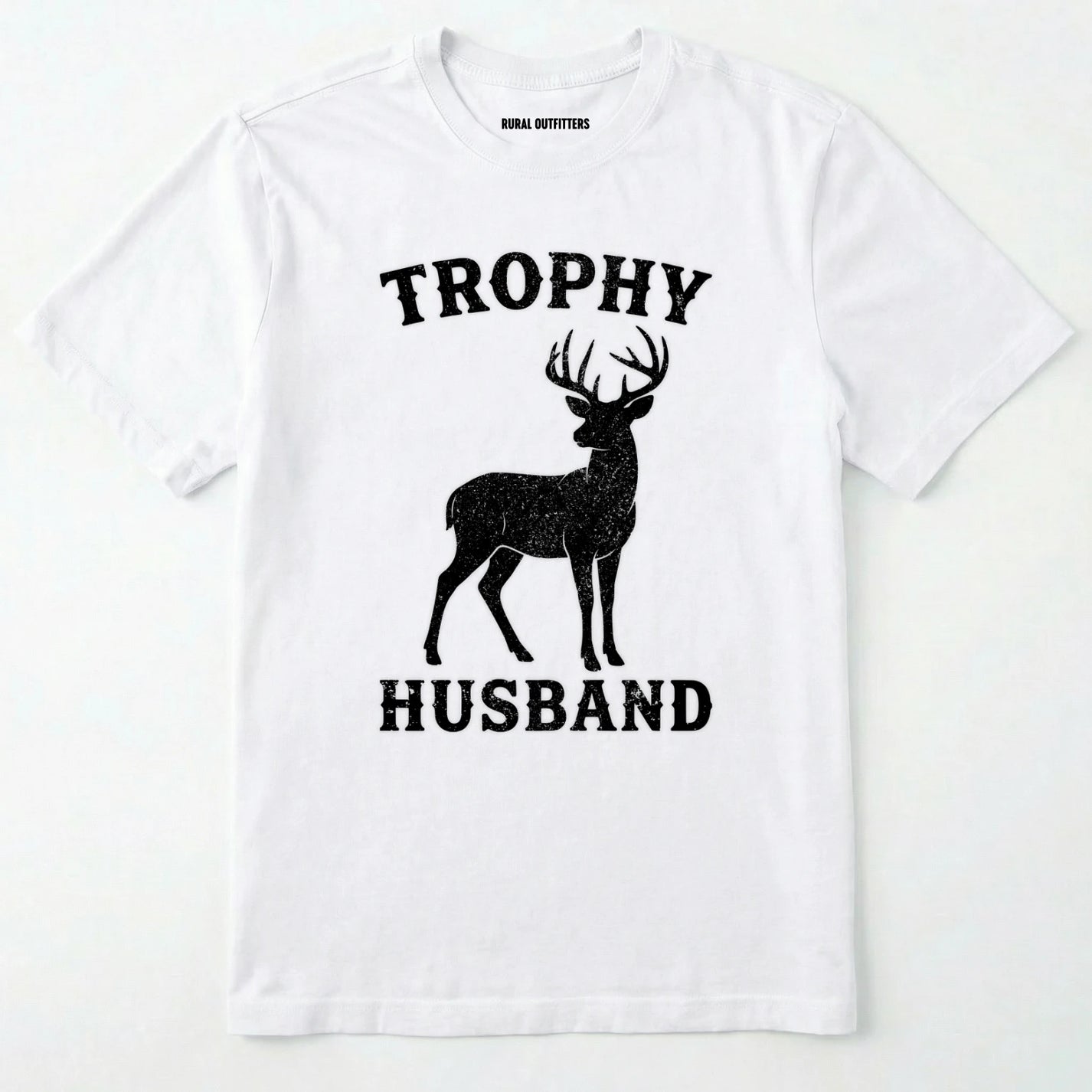 White t-shirt with black deer graphic and text 'trophy husband' on a white background