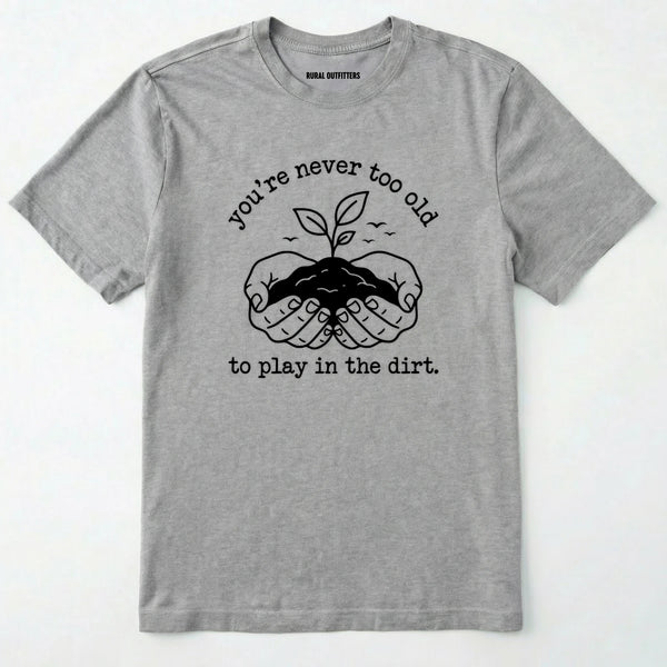Sport Grey t-shirt with black graphic and text 'you're never too old to play in the dirt' on a white background