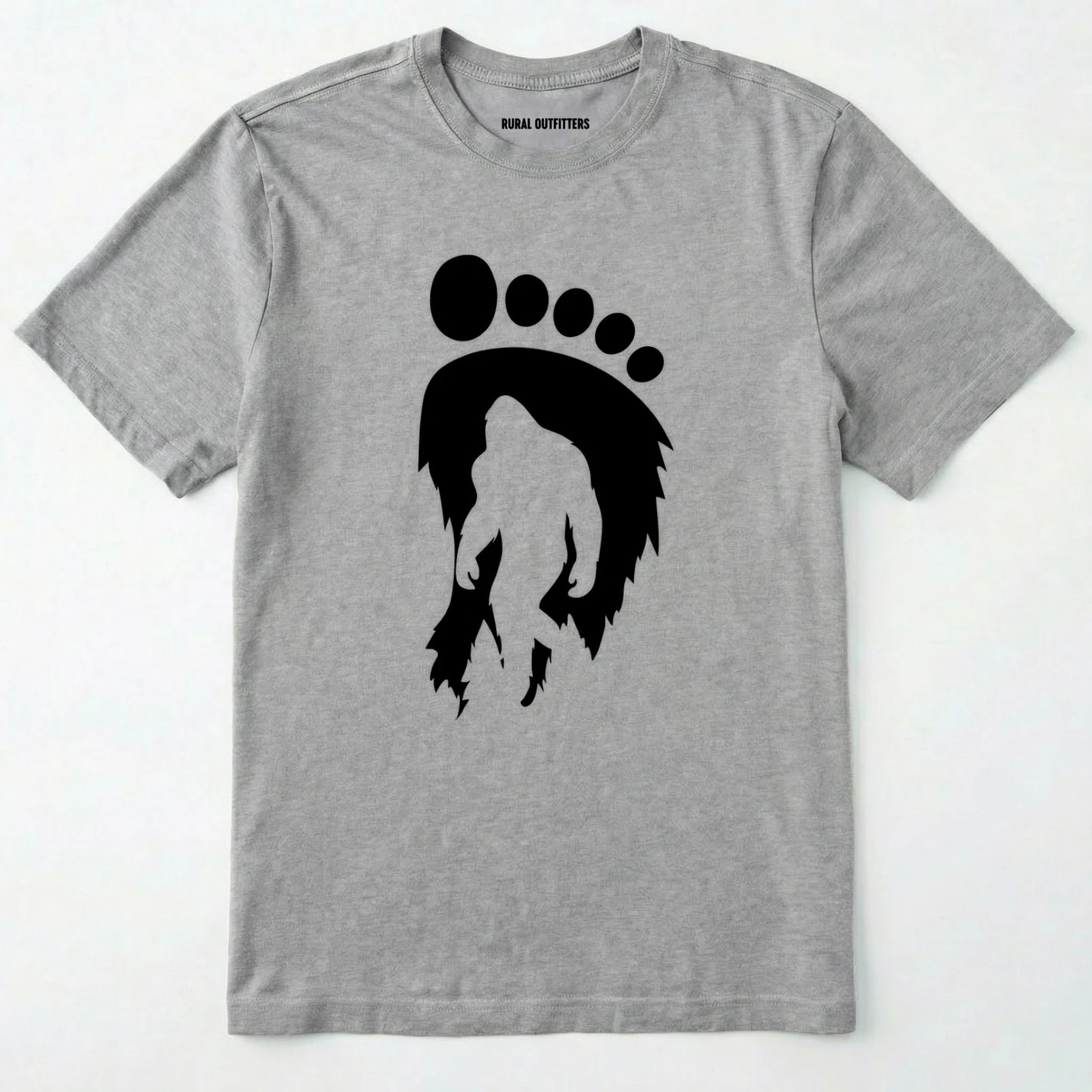 Sport Grey bigfoot t-shirt with cryptid-themed footprint graphic and sasquatch silhouette on a white background.