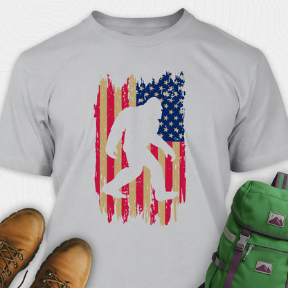 Grey bigfoot american flag shirt featuring patriotic grunge background