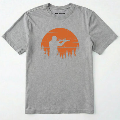 Sport Grey t-shirt with a graphic of a person holding a rifle against an orange sunset on a white background.