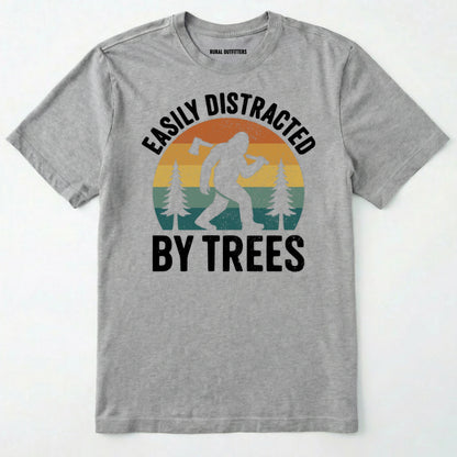 Sport Grey funny sasquatch shirt featuring bigfoot silhouette and trees on a white background.