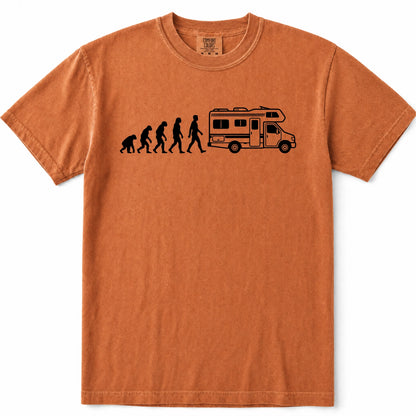 Yam orange crewneck t-shirt featuring a black graphic print of the evolution of man leading up to a walking person next to a camper van, displayed on a clean white background.