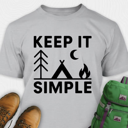 Sport grey keep it simple camping t-shirt with tent and campfire graphic with boots, and a backpack on either side on a white background