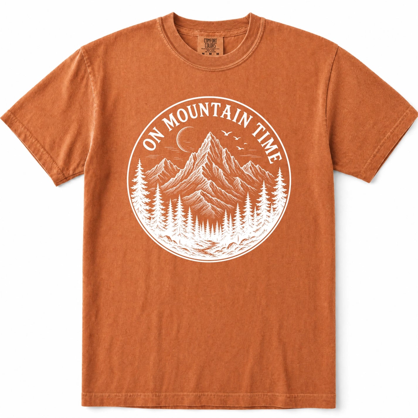 Yam crewneck t-shirt with a white circular graphic on the chest depicting a mountain, pine trees, and the text 'ON MOUNTAIN TIME'.