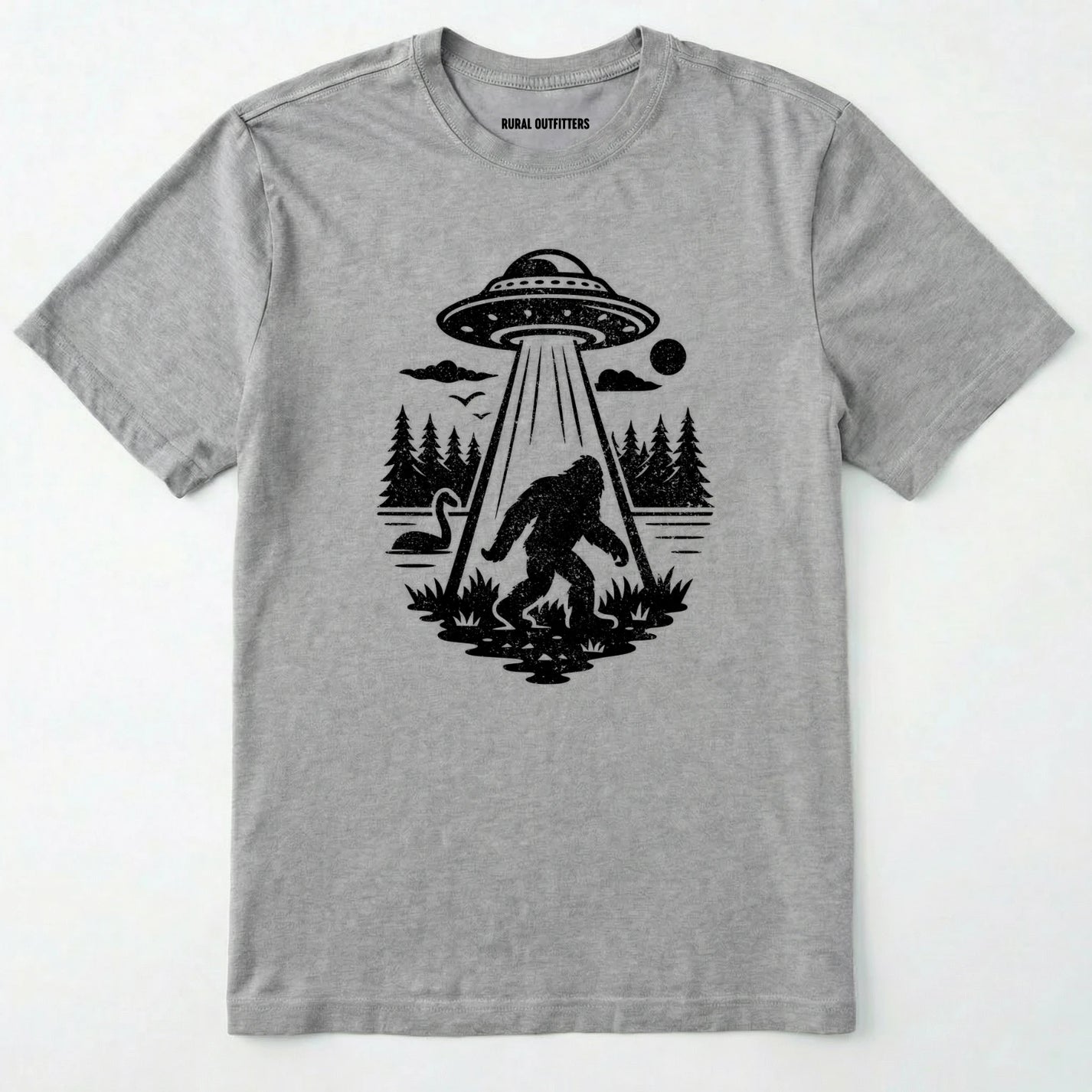Sport Grey monster shirt with Bigfoot, a forest scene, and a UFO beam graphic on a white background.