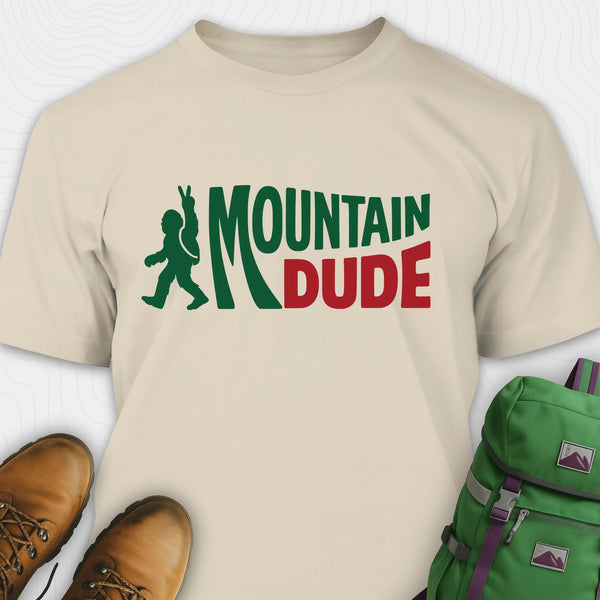 Sand Mountain Dude shirt with green and red text and Bigfoot graphic.