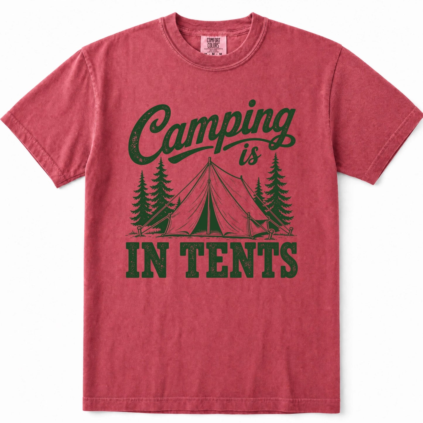 Crimson short-sleeve crewneck t-shirt in a washed, heathered red color, featuring a dark green graphic print on the front that reads 'Camping is IN TENTS' with an illustration of a tent and pine trees.