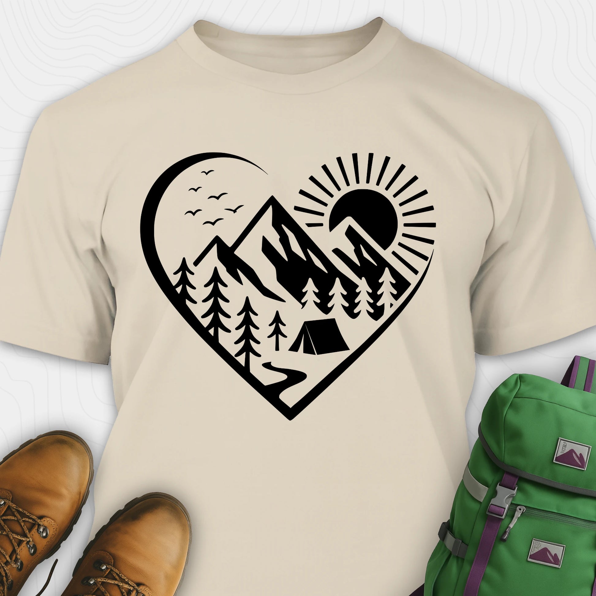 Sand nature t-shirt featuring heart graphic with mountains, trees, and tent illustration