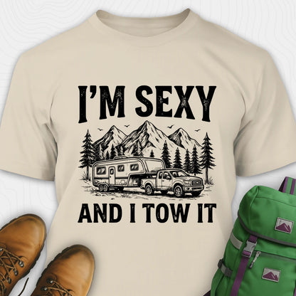Beige t-shirt with graphic design and text 'I'm Sexy and I Tow It' on a white background.