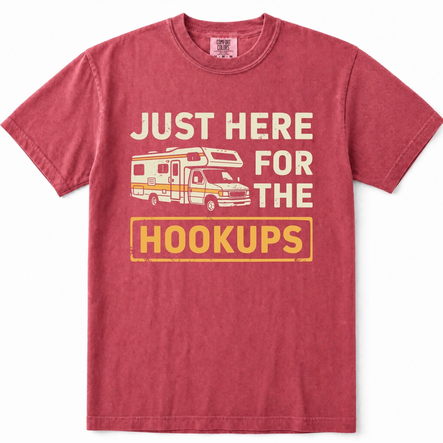 Crimson crewneck t-shirt featuring a vintage-style graphic print of an RV and the text 'JUST HERE FOR THE HOOKUPS' in cream and yellow.