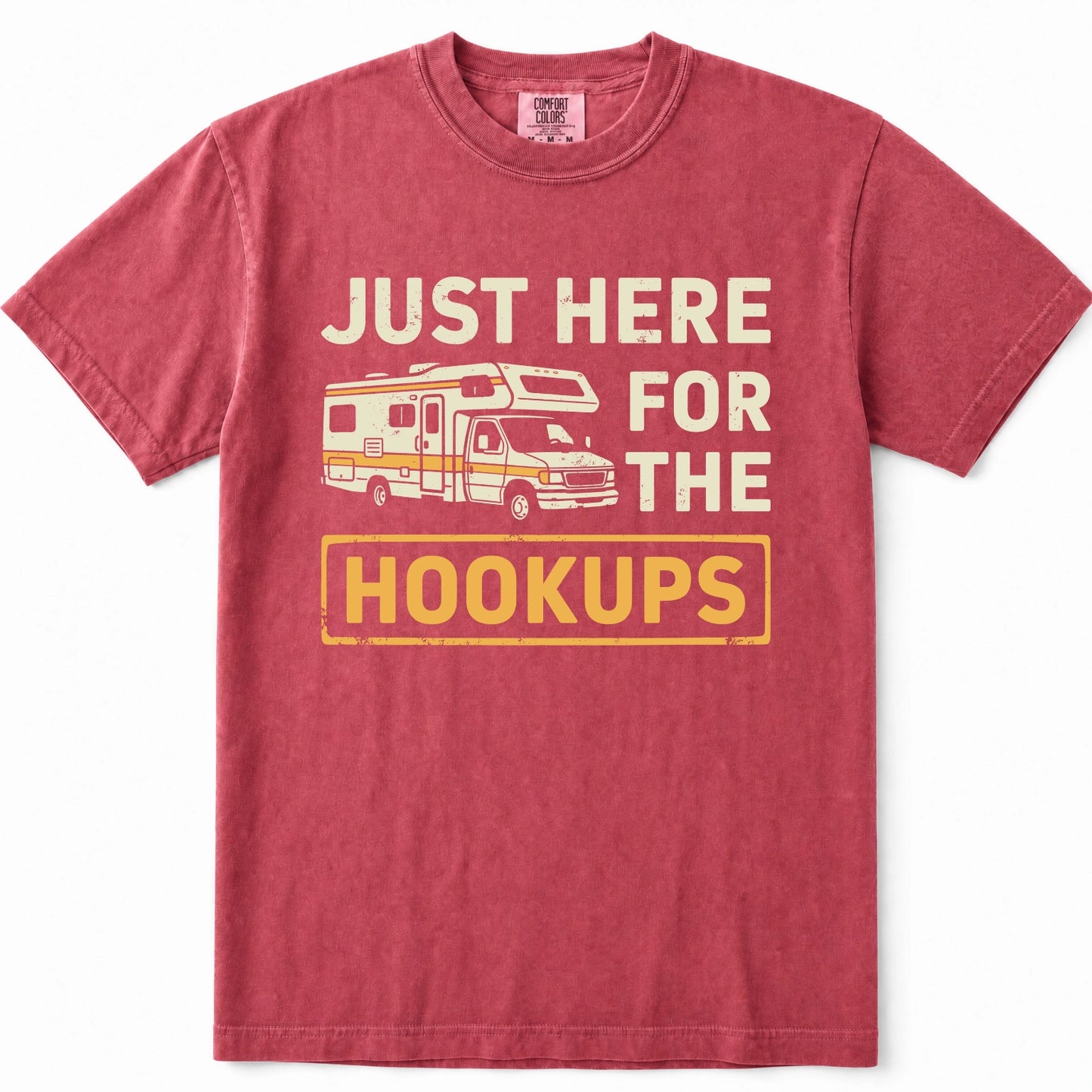 Crimson crewneck t-shirt featuring a vintage-style graphic print of an RV and the text 'JUST HERE FOR THE HOOKUPS' in cream and yellow.
