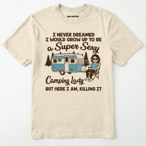 Natural t-shirt with a graphic of a woman by a camper and humorous text on a white background
