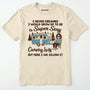 Natural t-shirt with a graphic of a woman by a camper and humorous text on a white background