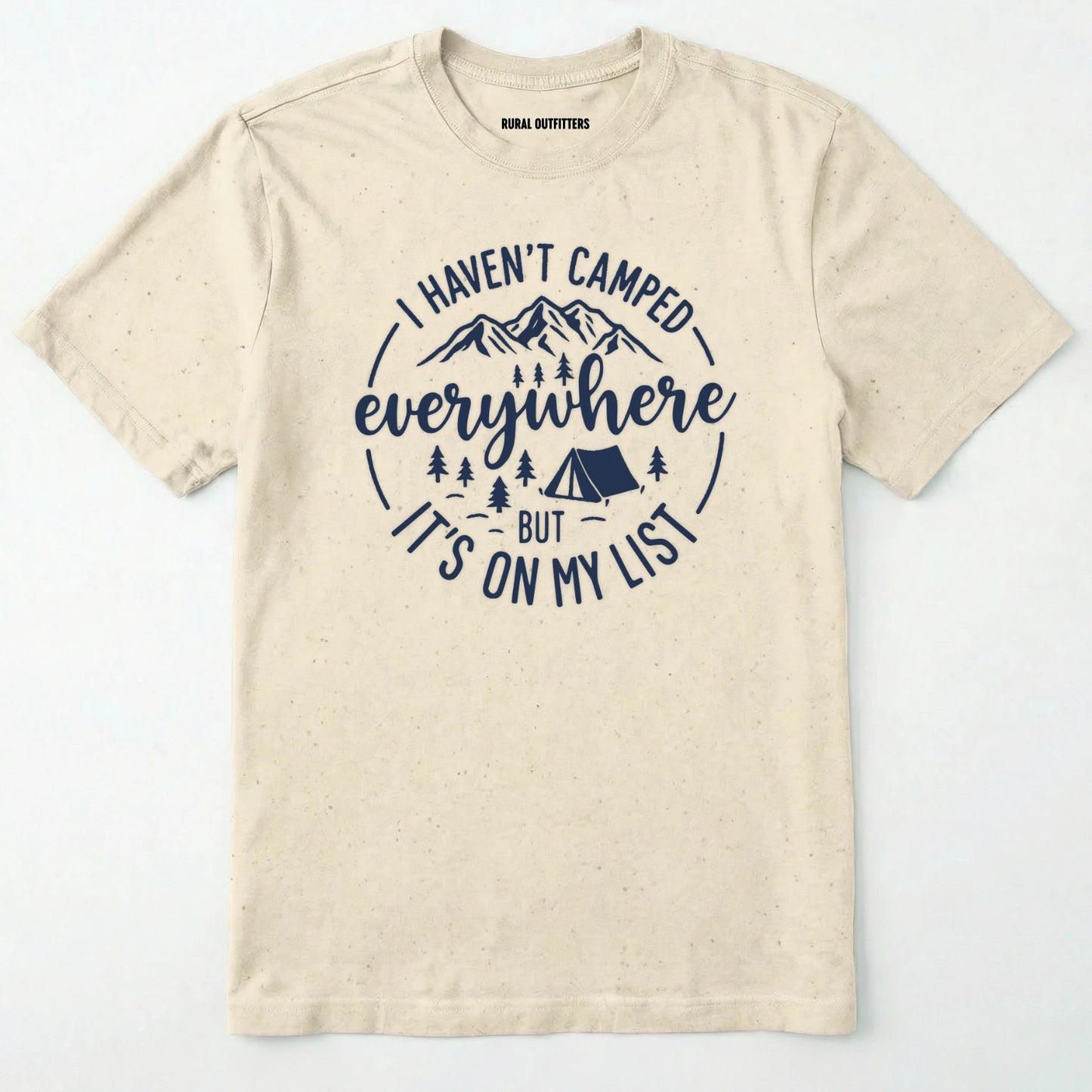 Natural funny camping shirt saying with mountains, trees, tent graphic and "I Haven't Camped Everywhere But It's On My List" text on a white background.