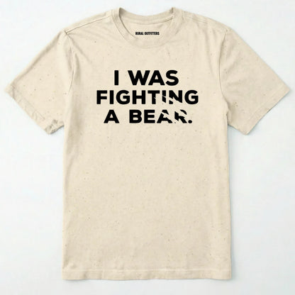Natural i was fighting a bear shirt with a bear scratch mark graphic on a white background.