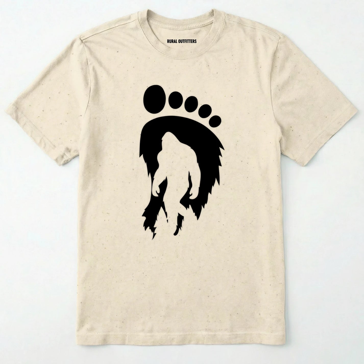 Natural bigfoot t-shirt with cryptid-themed footprint graphic and sasquatch silhouette on a white background.