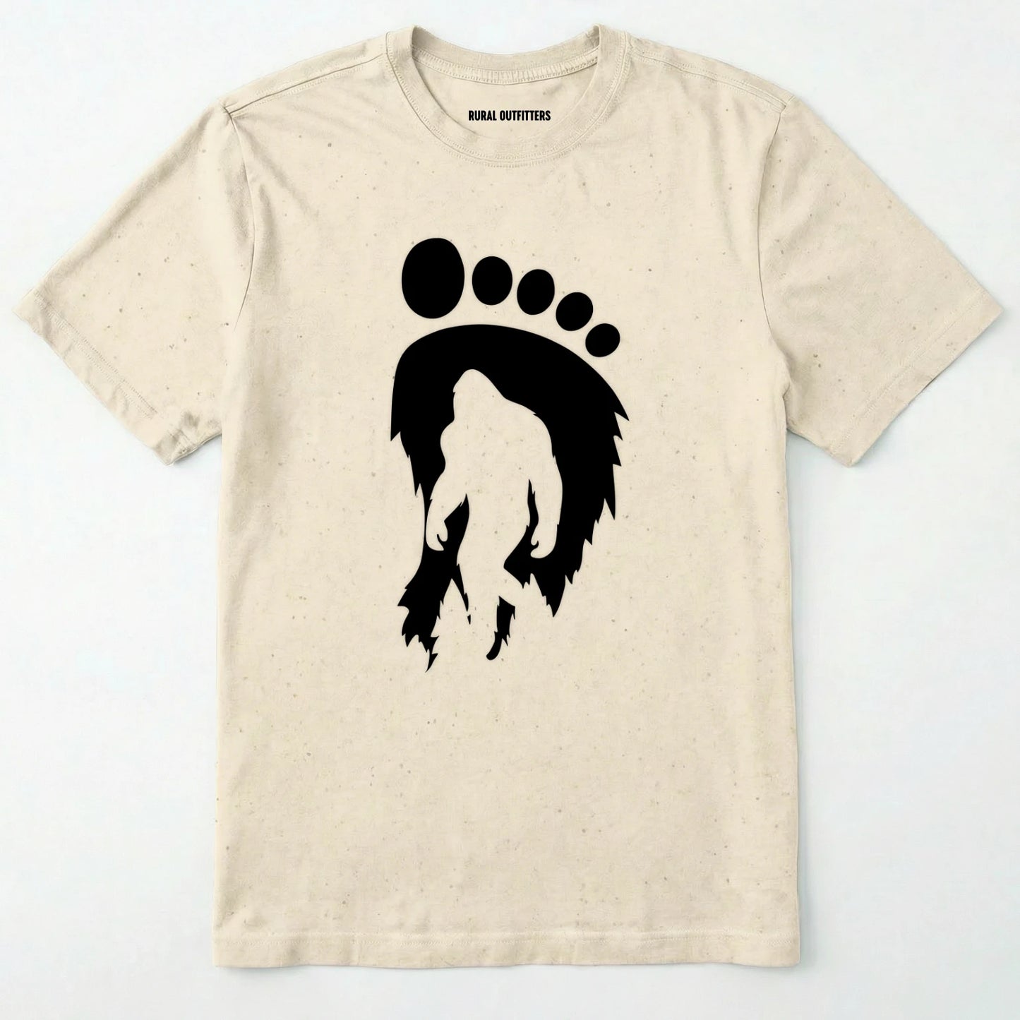Natural bigfoot t-shirt with cryptid-themed footprint graphic and sasquatch silhouette on a white background.