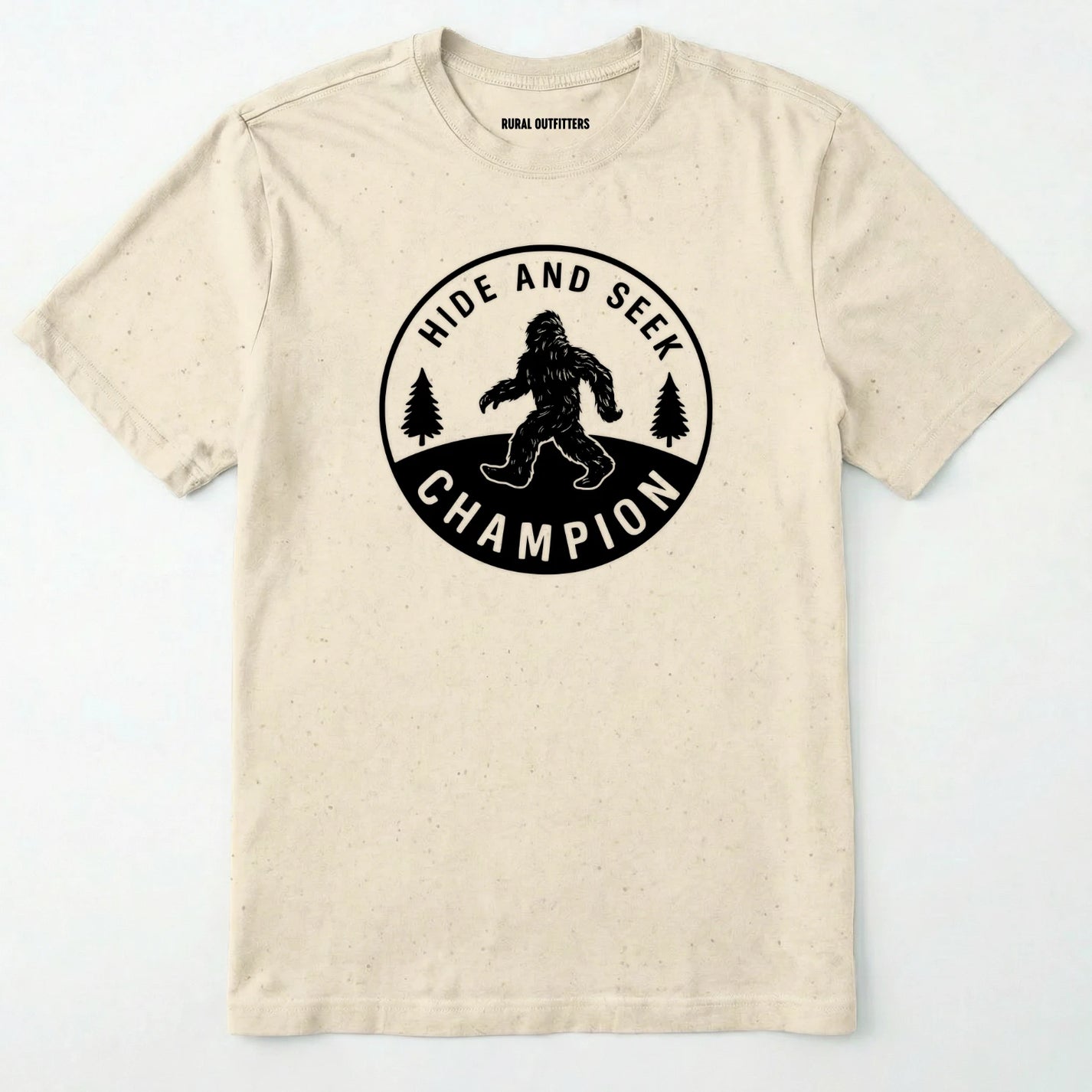 Natural bigfoot hide and seek champion shirt with forest emblem on a white background.
