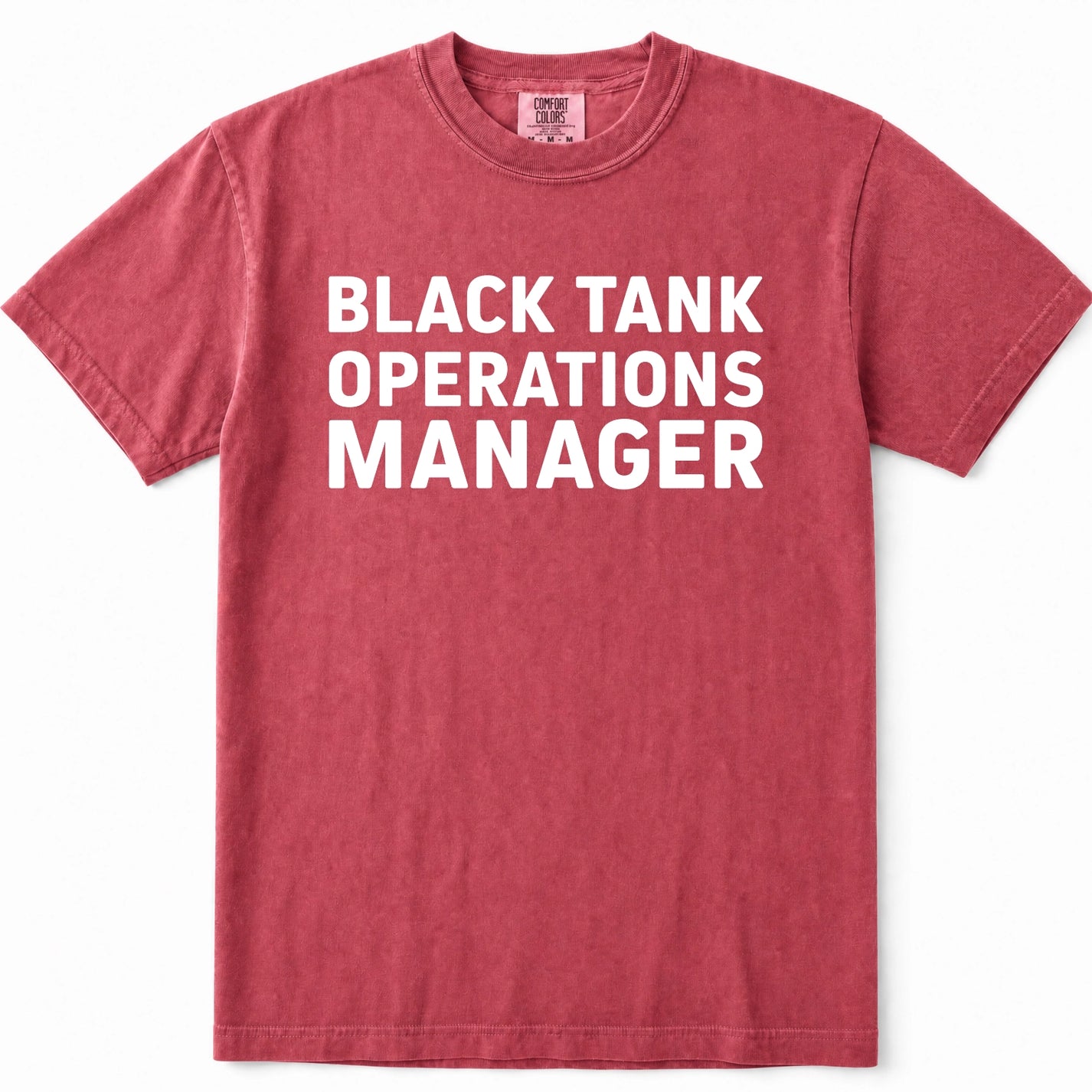 Crimson short-sleeve crewneck t-shirt in a washed, heathered red color, featuring the text 'BLACK TANK OPERATIONS MANAGER' printed in bold white capital letters across the chest.