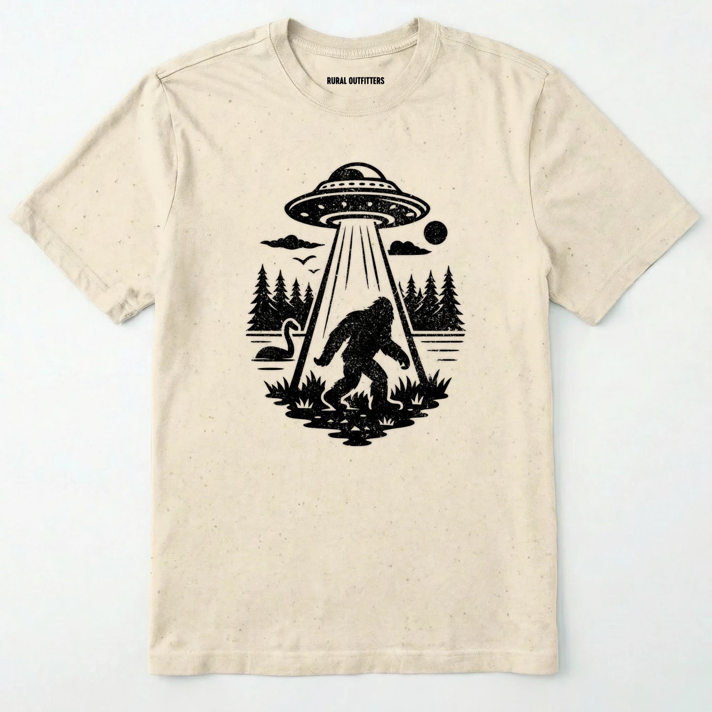 Natural monster shirt with Bigfoot, a forest scene, and a UFO beam graphic on a white background.