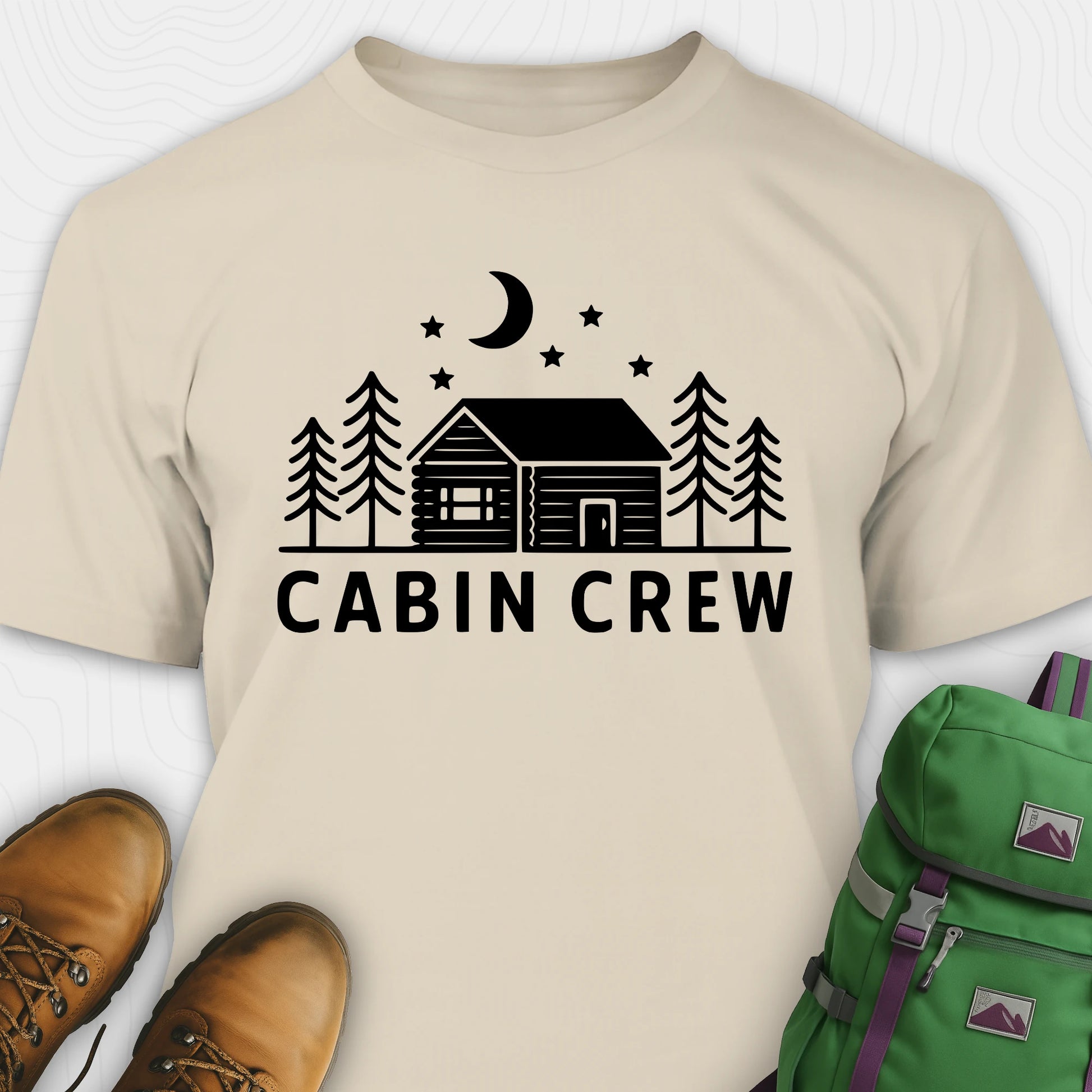 Sand cabin crew t-shirt with moon, pine trees and cabin design